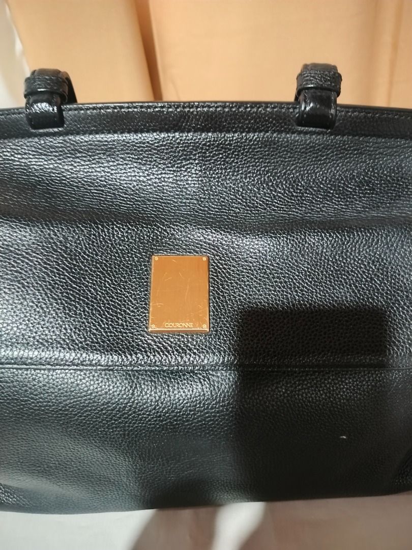 Couronne Black Leather Handbag (Category: Luxury Bags & Wallets) located in Marilao. Submitted by paadd (Listing ID 1430967820, Image 2). Description: Couronne satchel Black pebbled leather Good condition Price: 1100 Comes with detachable adjustable crossbody strap Buyer shoulders the shipping fee Meet-up available for sure buyers only SM Marilao foodcourt.
