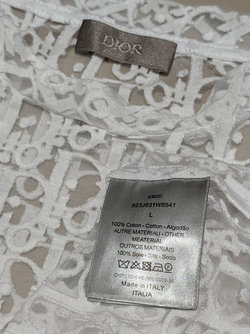 Dior White Lace T-shirt (Category: Shirts) located in Caloocan City. Submitted by wupeeram (Listing ID 1430847631, Image 2). Description: andyan n lahat details 1,500+sf issue nya nasa dulo Ng photo dko alam kung issue Yan pero tahi di nman butas pero gnyan sya dm for more info .. not sure if authentic but nice condition.