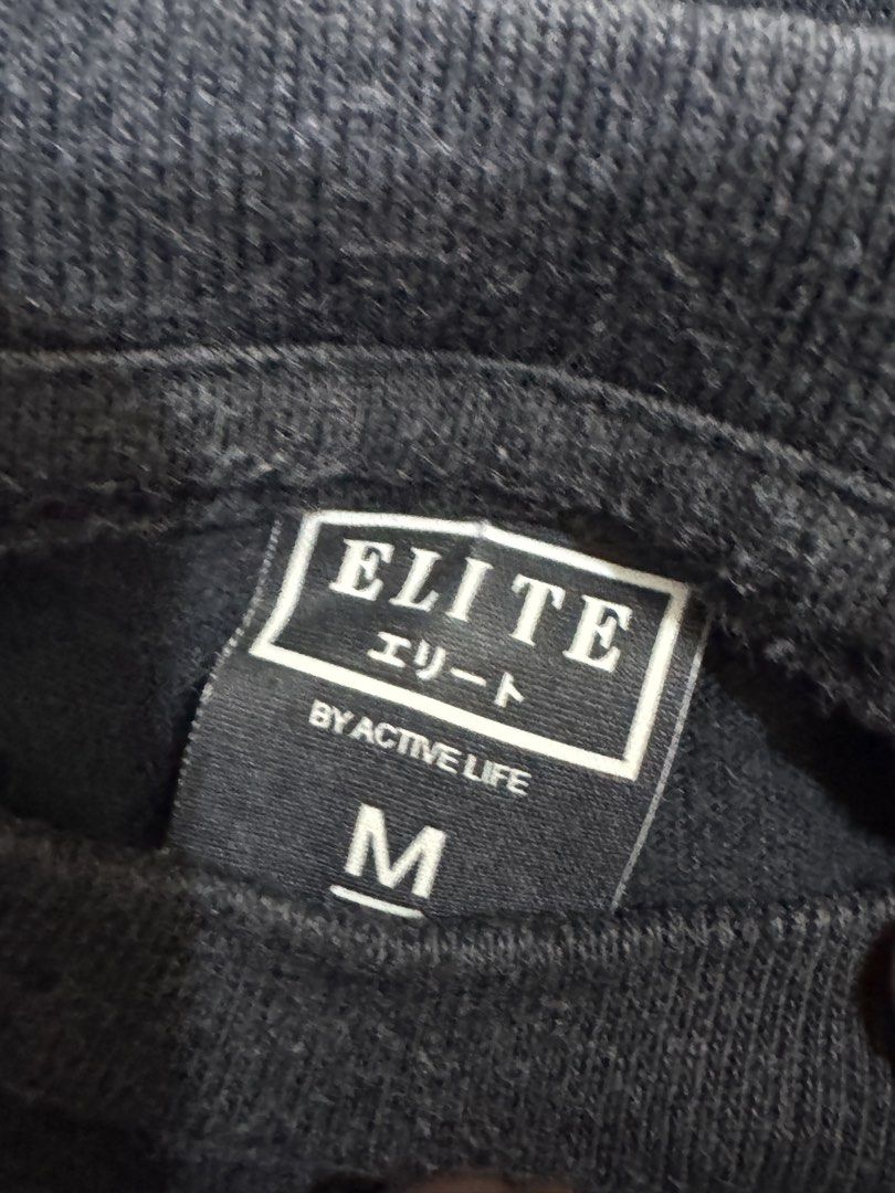 Elite Active Life Black T-shirt - Medium (Category: Tshirts & Polo Shirts ) located in Bacoor. Submitted by brianluistro (Listing ID 1430871860, Image 2). Description: Black Elite Active Life T-shirt in size Medium. Features a crew neck and short sleeves. The tag is visible, indicating the brand and size. A simple and versatile addition to any wardrobe..