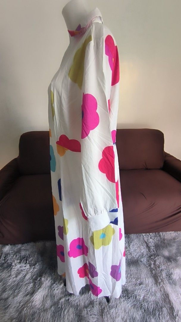 Floral Print Maxi Dress (Category: Dresses) located in Antipolo. Submitted by secondcharmstore (Listing ID 1430834977, Image 3). Description: sale 299 Maxi dress features a vibrant floral print on a white background. It has long sleeves and a collared neckline. The colorful floral pattern includes pink, blue, yellow, orange, and purple flowers. It's a stylish and eye-catching piece. no tag, never worn chest: 40-42 inches waist: 36-38 inches lengt