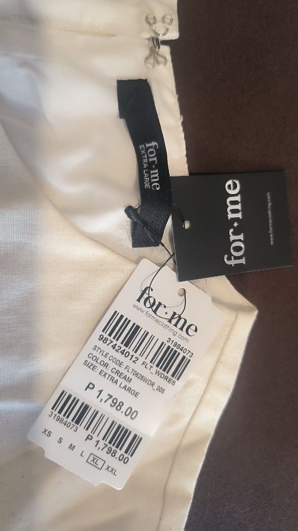 For Me Cream Dress Extra Large (Category: Dresses) located in Antipolo. Submitted by secondcharmstore (Listing ID 1430881819, Image 1). Description: sale 699 Cream-colored dress from For Me. It features short sleeves and a gathered waist. The dress has a round neckline and a slightly flared skirt. The size is extra large. The original price tag is still attached, showing a price of ₱1,798.00. chest: 38 inches waist: 32-34 inches length: 45.5 inch