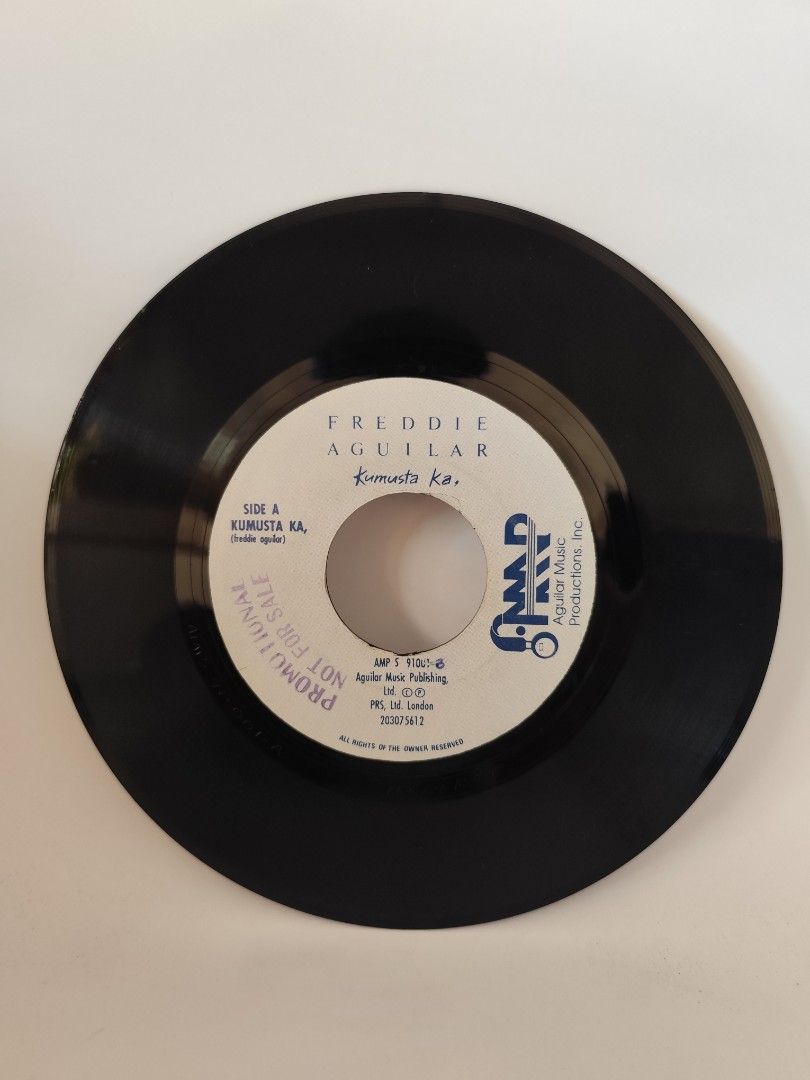 Freddie Aguilar Vinyl Record (Category: Vinyls) located in Davao. Submitted by pasio (Listing ID 1430872316, Image 2). Description: Vinyl record by Freddie Aguilar. Side A features the song "Kumusta Ka" and Side B features "Pag-ibig Sa Bayan". It was published by Aguilar Music Publishing. The record is a promotional copy..