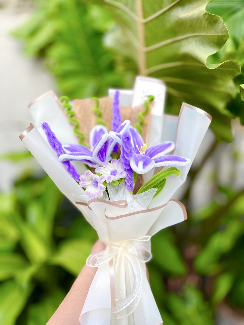 Handmade Fuzzy Wire Flower Bouquet (Category: Flowers & Bouquets) located in Batangas. Submitted by knotandcurl_creations (Listing ID 1430980027, Image 1). Description: - Handmade Fuzzy Wire Flower Bouquet - Features a charming design with purple and white fuzzy wire flowers. - Beautifully wrapped and ready to gift..