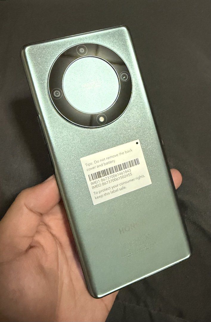 Honor X9a (Category: Cases & Sleeves) located in Makati City. Submitted by chrisniones (Listing ID 1430877017, Image 3). Description: The Honor X9a 5G is a mid-range smartphone featuring a 6.67-inch 120Hz curved OLED display, Snapdragon 695 5G chipset, and a 5,100mAh battery with 40W charging. It features a 64MP triple rear camera system and 8GB RAM with 256GB storage, characterized by its “ultra-tough” reinforced glass display. RFS: Need funds.