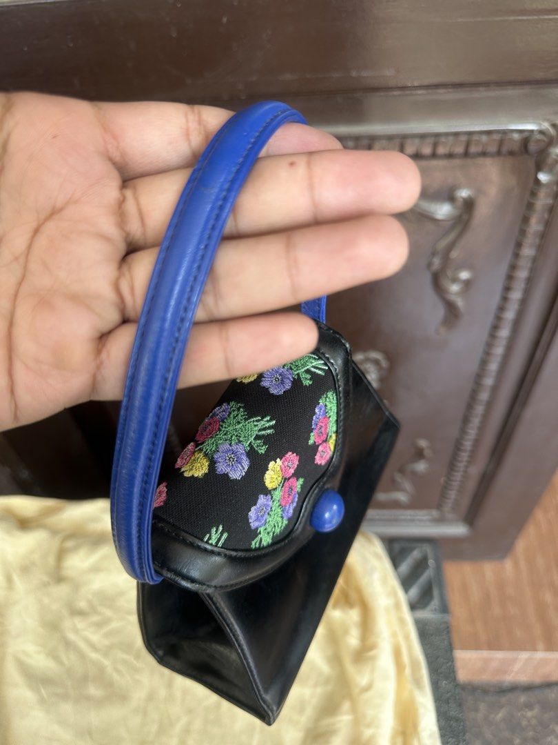 Kenzo Floral Embroidered Handbag (Category: Luxury Bags & Wallets) located in Bustos. Submitted by theprelovedshopbulacan (Listing ID 1430801668, Image 2). Description: Elegant Kenzo handbag featuring a black exterior with a floral embroidered top. It has a blue handle and a blue button closure. The interior is black with a Kenzo label. A stylish accessory for any occasion..