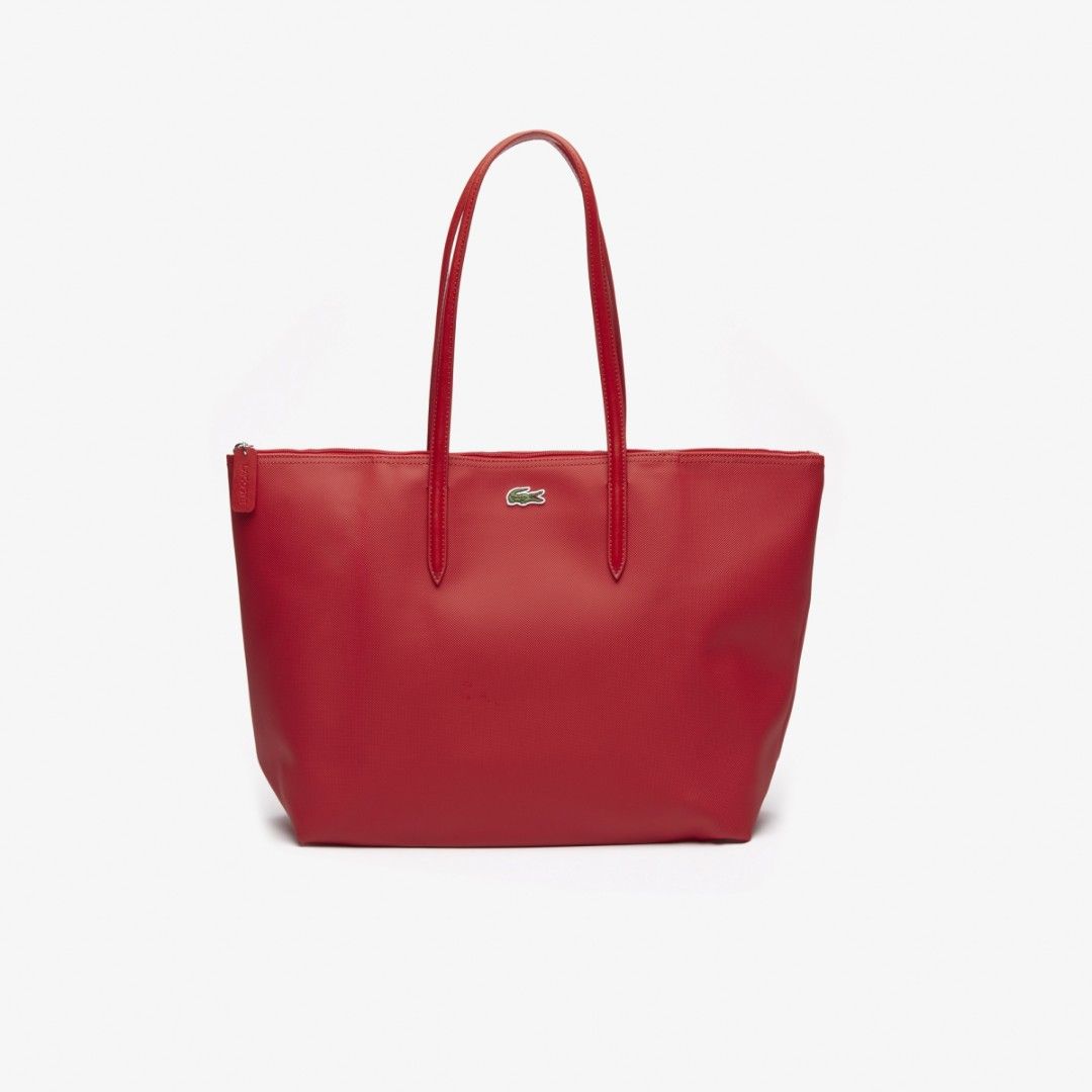 Lacoste Red Tote Bag (Category: Tote Bags) located in Manila. Submitted by sonummy (Listing ID 1430956998, Image 1). Description: - Lacoste tote bag in vibrant red. - Features a clean, minimalist design. - Secure top zipper closure. - Comfortable shoulder straps. - Includes the iconic Lacoste logo. - Made of a smooth material..