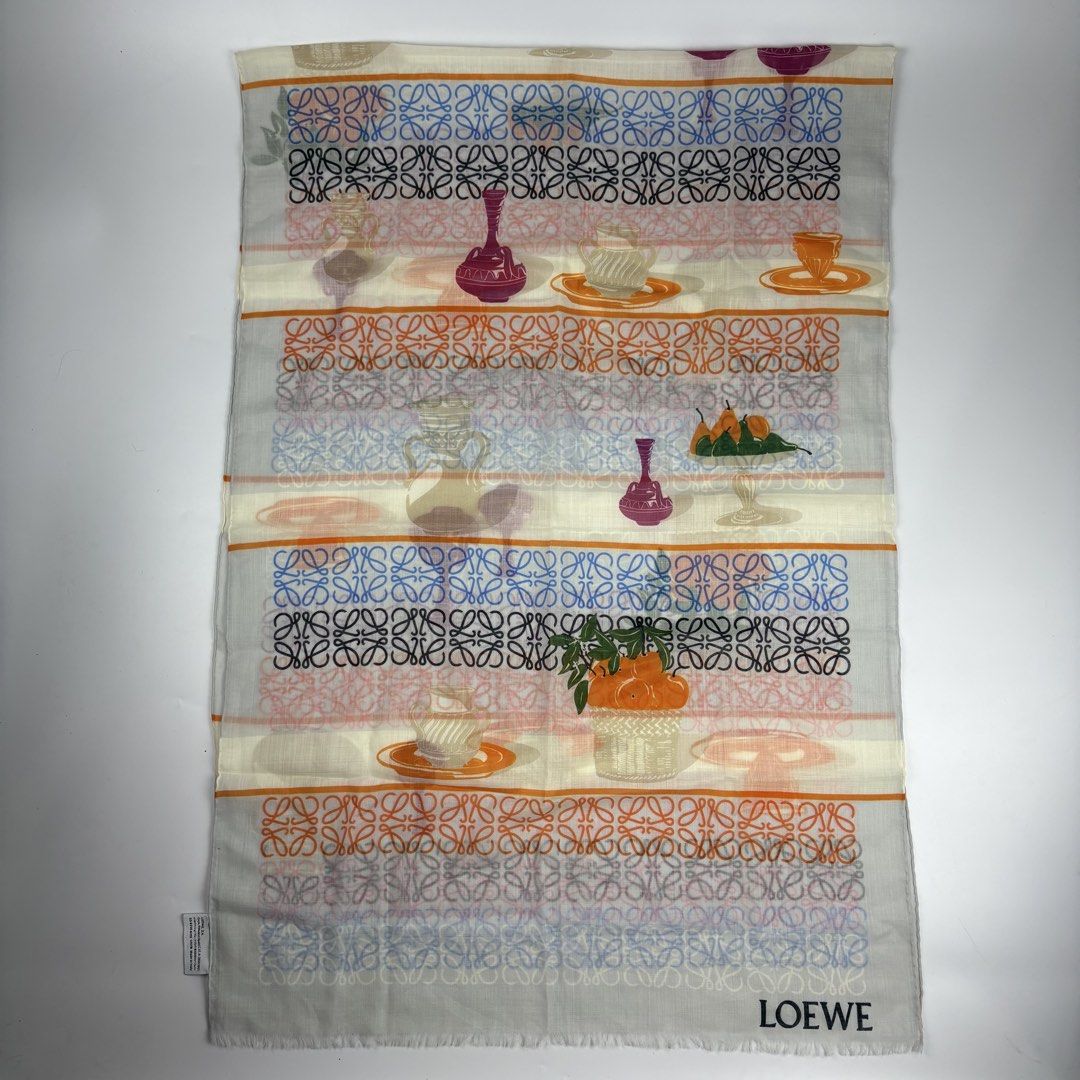 Loewe Anagram Printed Wool Scarf (Category: Luxury Accessories) located in Bacolod City. Submitted by cast.archives (Listing ID 1430953699, Image 1). Description: Loewe Anagram Printed Wool Scarf Authentic Size: Large Condition: Pristine Flaw: None Measurements Width: 26" Length: 72".