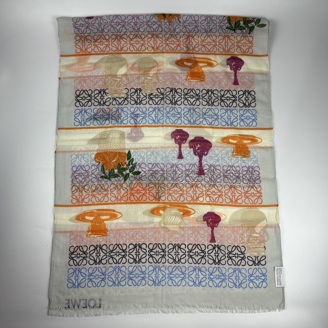 Loewe Anagram Printed Wool Scarf (Category: Luxury Accessories) located in Bacolod City. Submitted by cast.archives (Listing ID 1430953699, Image 2). Description: Loewe Anagram Printed Wool Scarf Authentic Size: Large Condition: Pristine Flaw: None Measurements Width: 26" Length: 72".