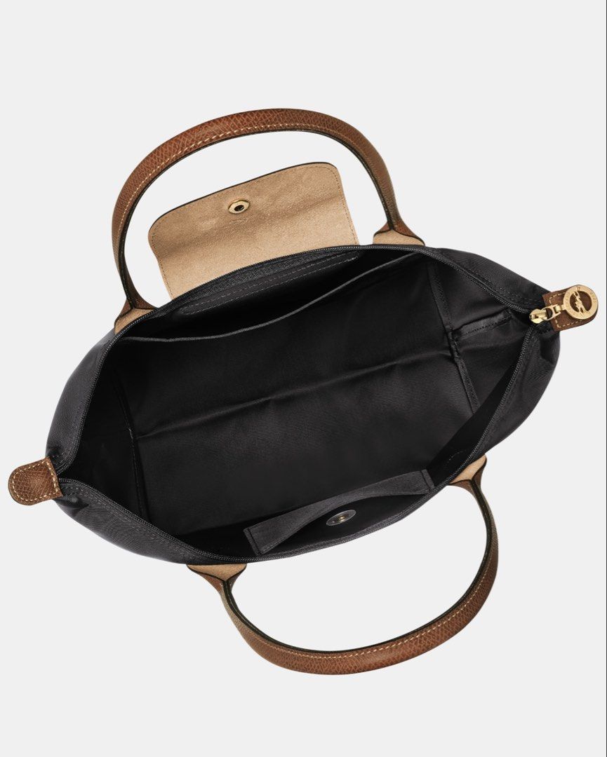 Longchamp Le Pliage Tote Bag in Black (Medium) (Category: Luxury Bags & Wallets) located in Quezon City. Submitted by mahliknvrr (Listing ID 1430853837, Image 2). Description: - original - color black in size medium - bought in dubai - like new condition (no flaws) - comes with the original packaging and paper bag - srp in the Philippines is 10,000 pesos .