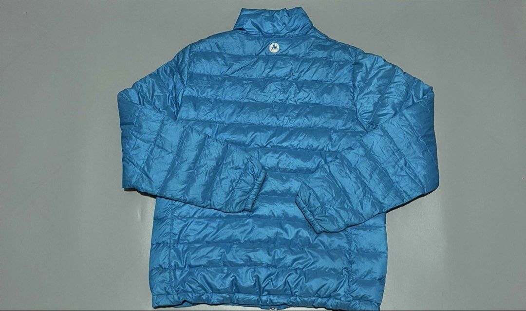 Marmot Zip-Up Puffer Jacket (Category: Activewear) located in Angeles City. Submitted by andreiboughts (Listing ID 1430814653, Image 2). Description: Length: 27 Width: 21-22 Condition: 9/10 Color rate: 10/10 Issue (s): Scratches and repaired parts Complete Tags ✅ XL on tag.