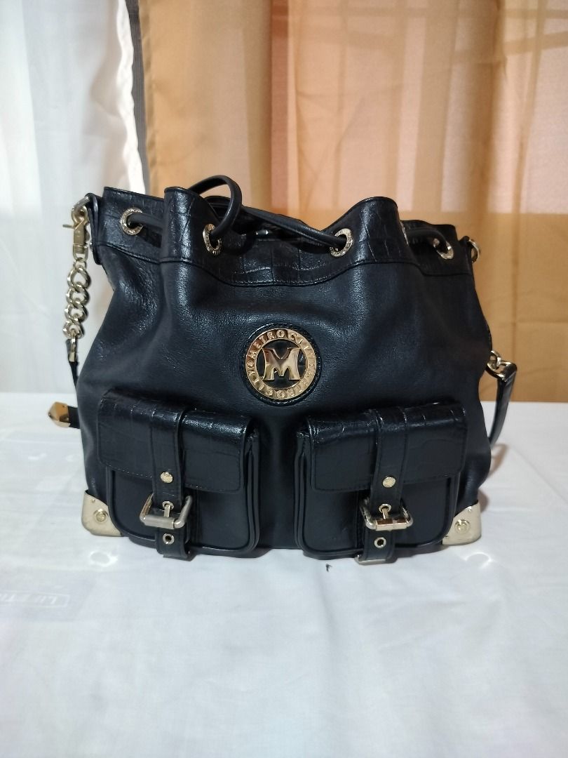 Metro City Black Bucket Bag (Category: Luxury Bags & Wallets) located in Marilao. Submitted by paadd (Listing ID 1430939272, Image 1). Description: Metrocity Italy brand Black soft leather bucket-style bag Good condition Price: 1350 Chain-and-leather shoulder strap Drawstring top closure Issue: Slight fading on the goldware at the bottom of the bag (visible in photo) Buyer shoulders the shipping fee Meet-up available for sure buyers only SM Maril