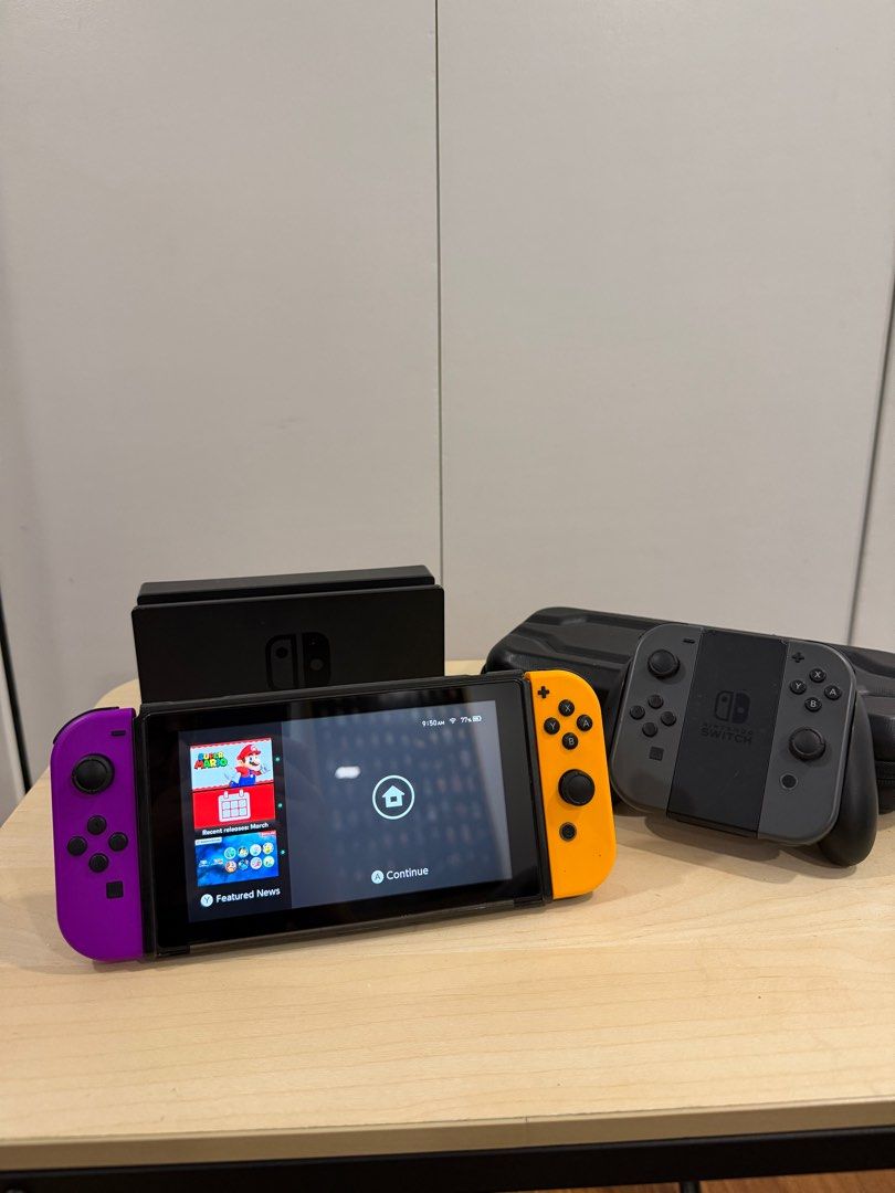 Nintendo Switch v1 with 4 Joycons (Category: Nintendo) located in Quezon City. Submitted by m_gomez45 (Listing ID 1430809258, Image 2). Description: For Sale Nintendo Switch v1 with complete box and original accessories (charger, dock, HDMI, handheld controller, and grips) + 128gb microSD - with 4 joycons (2 original gray with console, plus 2 orange and purple bought from Japan) - with microSD purchased separately - with original receipt from gam