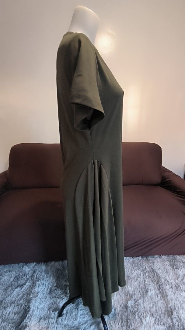Plains & Prints Olive Green Dress (Category: Dresses) located in Antipolo. Submitted by secondcharmstore (Listing ID 1430887978, Image 3). Description: -sale 900 Olive green dress from Plains & Prints. Features a round neckline and short sleeves. The dress has a ruched detail on one side and a pleated design on the other side. The dress falls to a midi length. The tag indicates a size of UK 16 and US 12. original price P2598 no tag, never worn ch