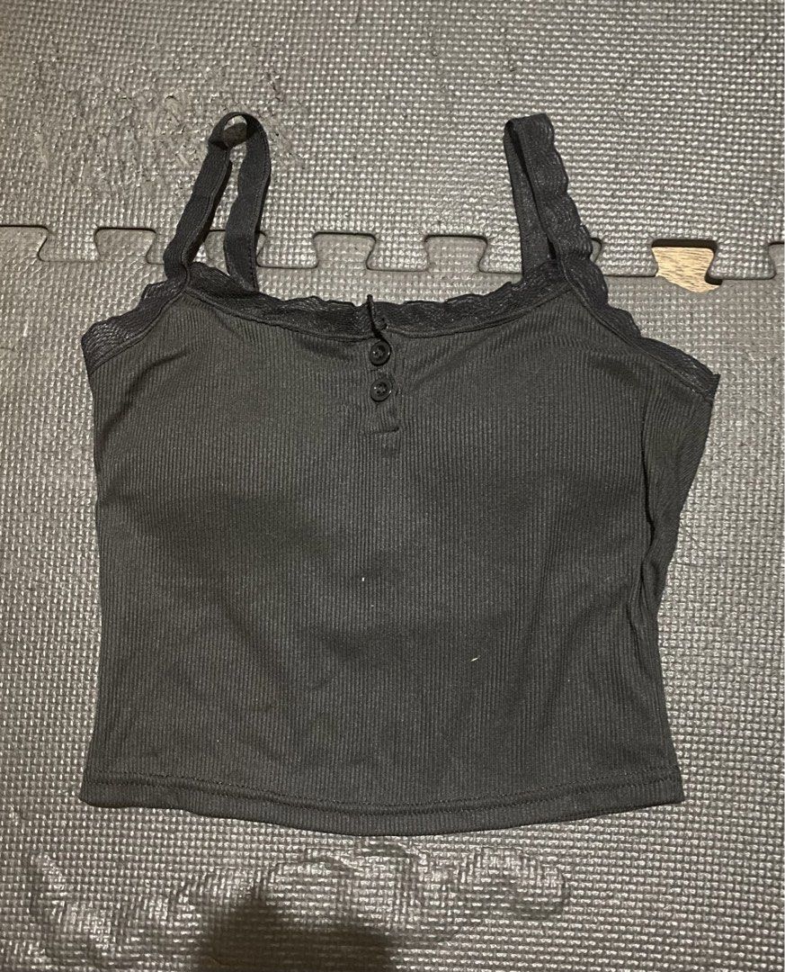 Ribbed Tank Top with Lace Trim (Category: Sleeveless) located in San Mateo. Submitted by katka_cat (Listing ID 1430937112, Image 2). Description: Tank top features a ribbed design with delicate lace trim along the neckline and straps. It has a button-up front detail. Available in black and olive green. The tank top is a cropped style, perfect for pairing with high-waisted bottoms. It is a versatile piece suitable for various casual outfits..
