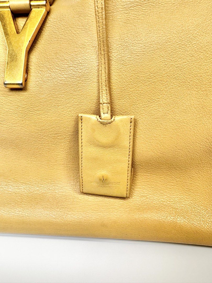 Saint Laurent YSL Cabas Chyc Handbag (Category: Luxury Bags & Wallets) located in Paranaque City. Submitted by gabprelovedstuff (Listing ID 1430819643, Image 3). Description: Project Bag - needs TLC from bag spa hence low price - Medium Size - Features the iconic YSL logo Price is final.