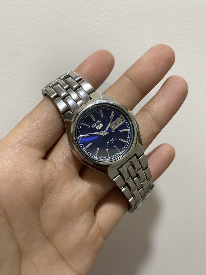 Seiko 5 Automatic "Blue Sunburst" (JDM) (Category: Luxury Watches) located in Baliuag. Submitted by watchmechanic (Listing ID 1430928084, Image 2). Description: Seiko 5 Automatic "Blue Sunburst" (JDM) Price: ₱ Condition: Good running condition Quick Specs: Movement: 21-Jewel Automatic Dial: Stunning Deep Blue Sunburst Features: Day/Date window (English/Arabic) Build: All Stainless Steel, "Made in Japan" model Details: Authentic and original. Keep