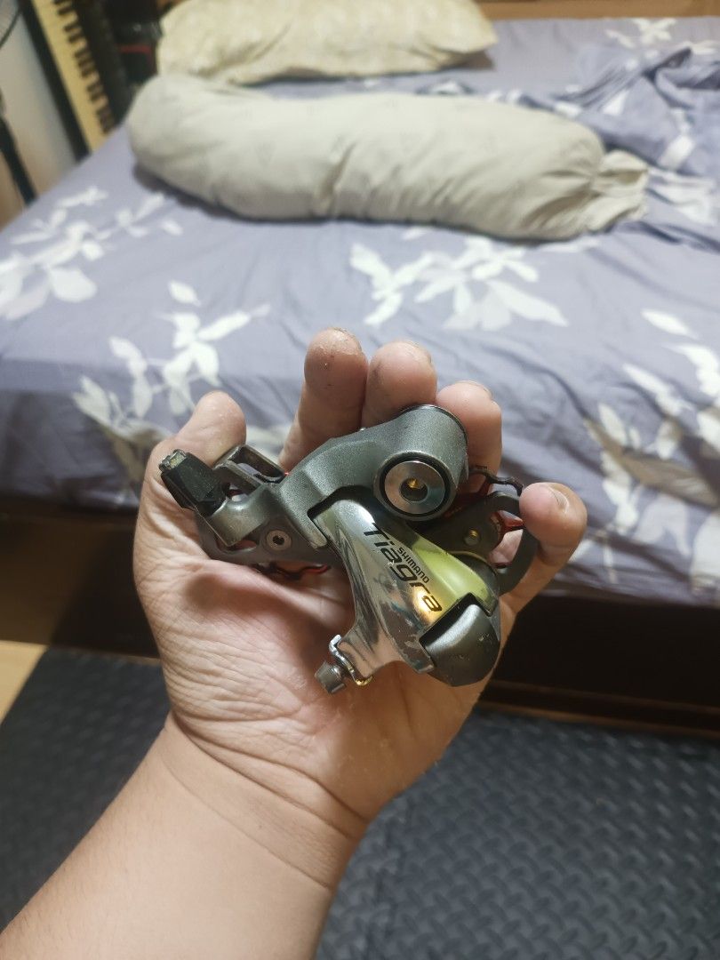 Shimano Tiagra Rear Derailleur (Category: Bicycles) located in Meycauayan. Submitted by boldcrystal-4925 (Listing ID 1430956670, Image 1). Description: Shimano Tiagra rear derailleur. The derailleur has a silver chrome color. The cage has a sagmit pulley(still very usable.