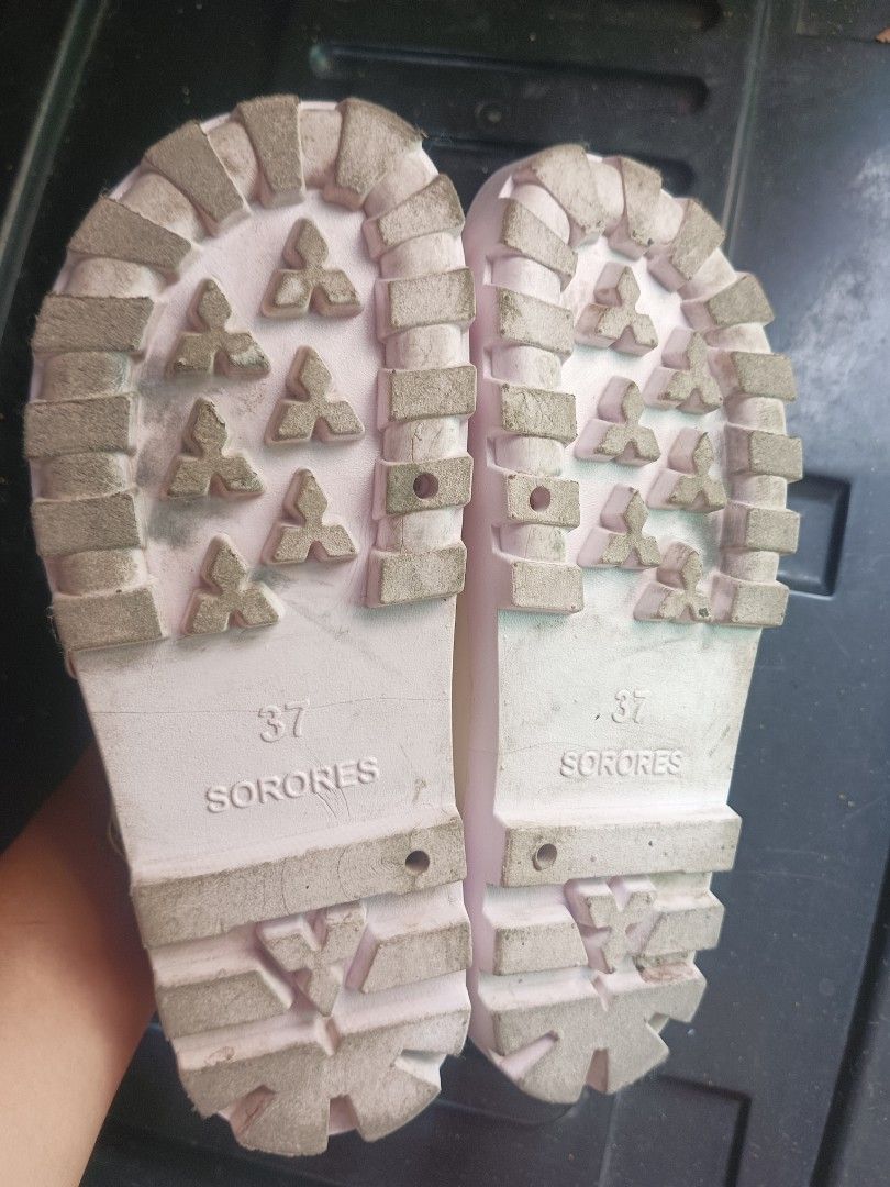 Sorores White Sandals Size 37 (Category: Flats & Sandals) located in Malabon City. Submitted by mslalan (Listing ID 1430806414, Image 2). Description: White Sorores sandals with double buckle straps. The sandals have a cork-like footbed and a thick, white sole. The size is 37, as indicated on the sole. The soles show some signs of wear. The sandals have gold-colored buckles..
