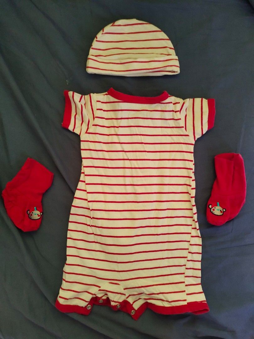 Striped Baby Outfit Set (Category: Babies & Kids Fashion) located in Imus. Submitted by saritacaredandpreloved (Listing ID 1430801188, Image 2). Description: Adorable baby outfit set featuring a striped romper, a matching hat, and a pair of socks. The romper has a button-down front and short sleeves. The set is trimmed with red accents. The socks have a cute design. Perfect for your little one!.