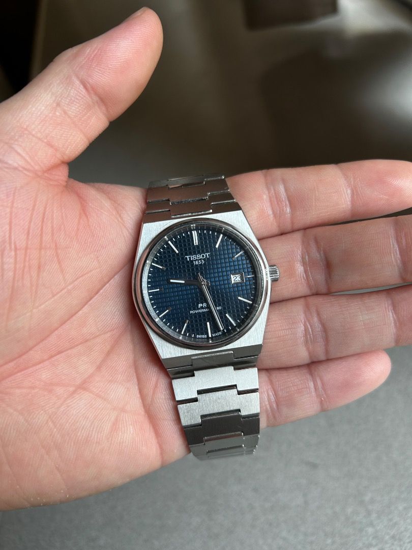 Tissot PRX Powermatic 80 Watch (Category: Luxury Watches) located in Caloocan City. Submitted by zealflower-9bc4 (Listing ID 1430723461, Image 2). Description: Currently selling my Tissot PRX Powermatic 80. It has a blue dial and a stainless steel bracelet. Was purchased in 2023 and is well used. The bracelet does have minor scratches but the sapphire crystal is in pristine condition. Comes with the original box and papers. .
