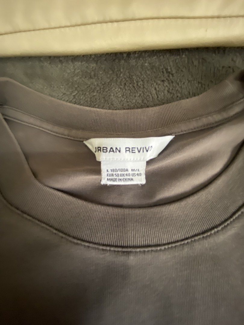 Urban Revivo Oversized T-shirt with Bear Patch (Category: Tshirts & Polo Shirts ) located in Kalayaan. Submitted by kolaso29 (Listing ID 1430893157, Image 2). Description: - Urban Revivo oversized t-shirt - Muted grey color - Features a small bear patch on the chest pocket - Size: L (fits M/L) - Made in China - Condition: Good.