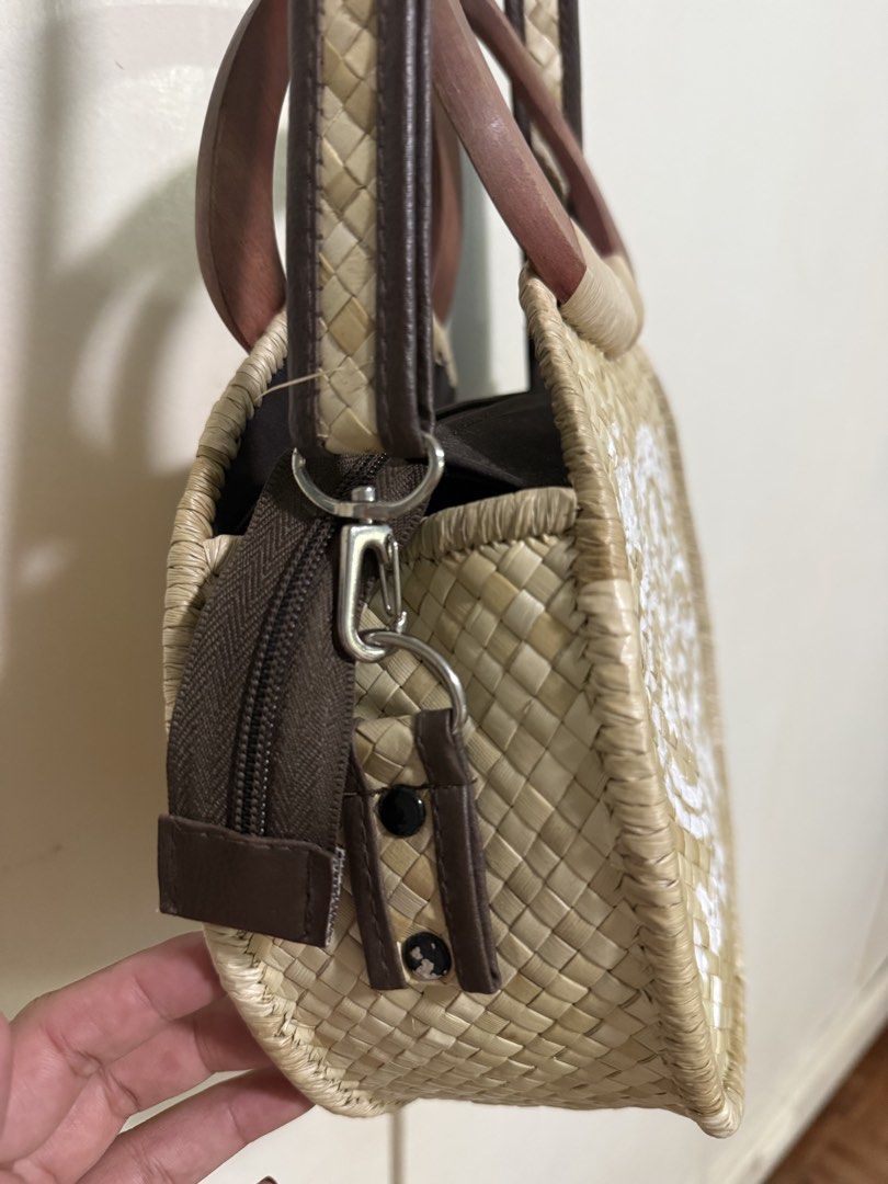 Woven Sling Bag Body Bag (Category: Beach Bags) located in San Carlos City. Submitted by achisfinds (Listing ID 1430917772, Image 2). Description: Made locally in the Philippines Handwoven & handpainted With sturdy wooden handles.