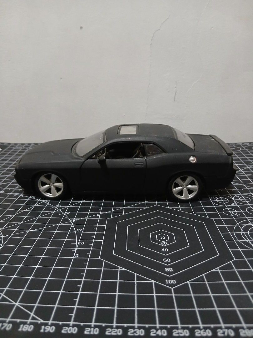 - Maisto 1/24 scale Dodge Challenger Diecast (Category: Vehicle & Diecast Models) located in Tanauan. Submitted by jeuskingz (Listing ID 1431171147, Image 3). Description: - Maisto 1/24 scale Dodge Challenger diecast. - Sleek black color. - Detailed interior and engine. - Paint Chips - Opening doors and hood. - Ideal for collectors and car enthusiasts. - Side Mirror Left Side Missing.
