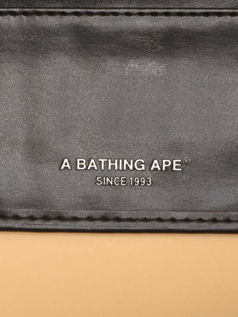 A BATHING APE MAGAZINE RELEASED WALLET (Category: Luxury Bags & Wallets) located in Manila. Submitted by rewearables.mnl (Listing ID 1431082197, Image 3). Description: FOR SALE -A BATHING APE MAGAZINE RELEASED WALLET CONDITION:10/10 COLOR RATE:10/10 ISSUE: MICRO SCRATCHES IN MONKEY LOGO ASKING PRICE:1500 **REWEARABLES PRODUCT DISCLAIMER** All thrift items are pre-loved and may show minor signs of wear or age. Please review photos and descriptions