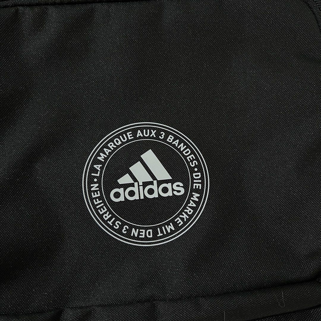 Adidas Classic 3-Stripes Sackpack Drawstring Bag (Category: Backpacks) located in Quezon City. Submitted by jhb218 (Listing ID 1431068550, Image 2). Description: - Dimensions: 36.75 cm x 5 cm x 47 cm - 100% recycled polyester - Easy cinch opening with durable cording - Secure zip pocket -Product color: Black.