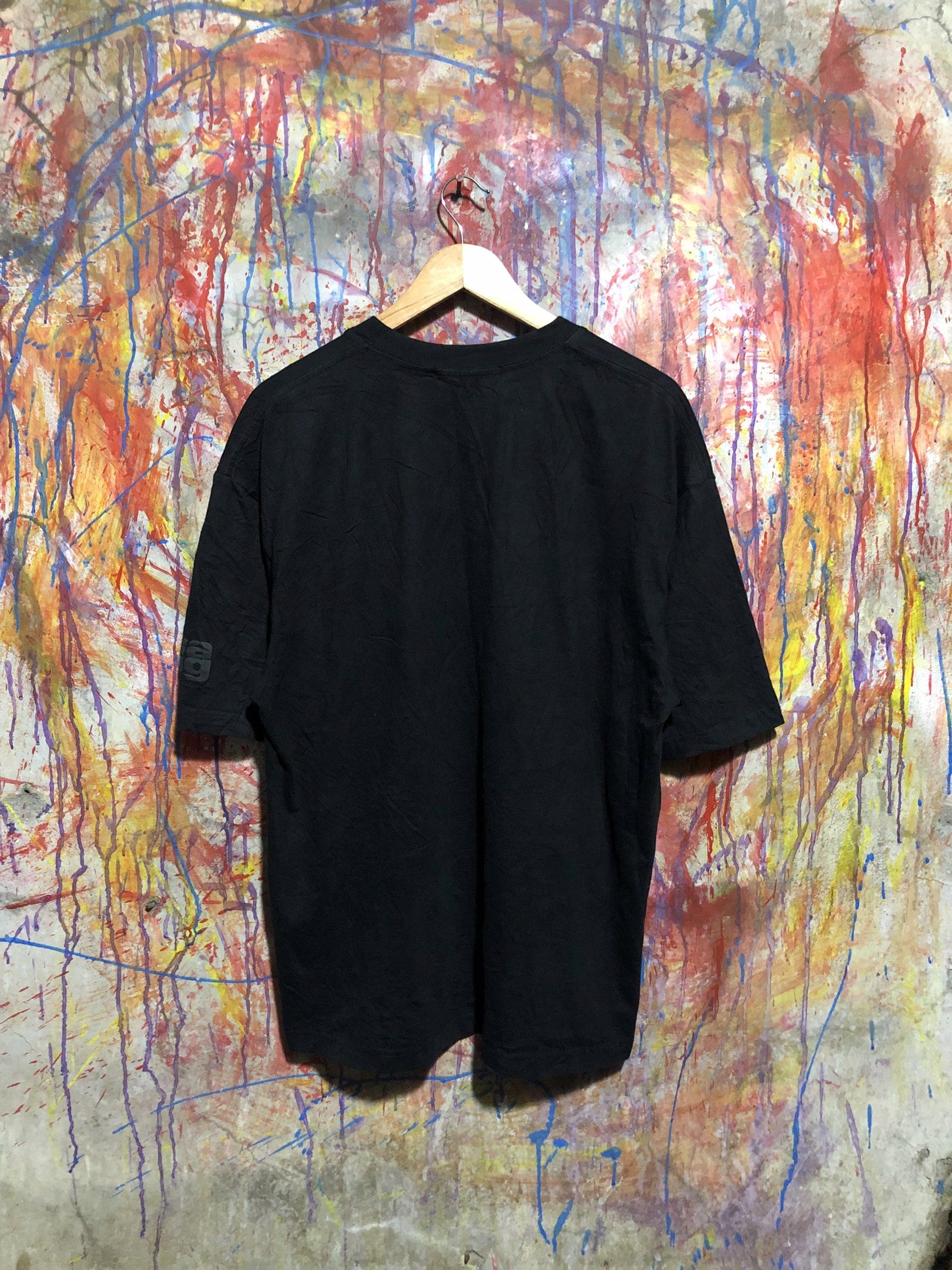 Alexander Wang Black Tshirt (Category: Luxury Apparel) located in Quezon City. Submitted by unholy_finds (Listing ID 1431049661, Image 2). Description: - Black Alexander Wang T-shirt - Size: XL - Features brand logo on sleeve and neckline - Material: 100% Cotton - Relaxed fit - Washing instructions on tag.
