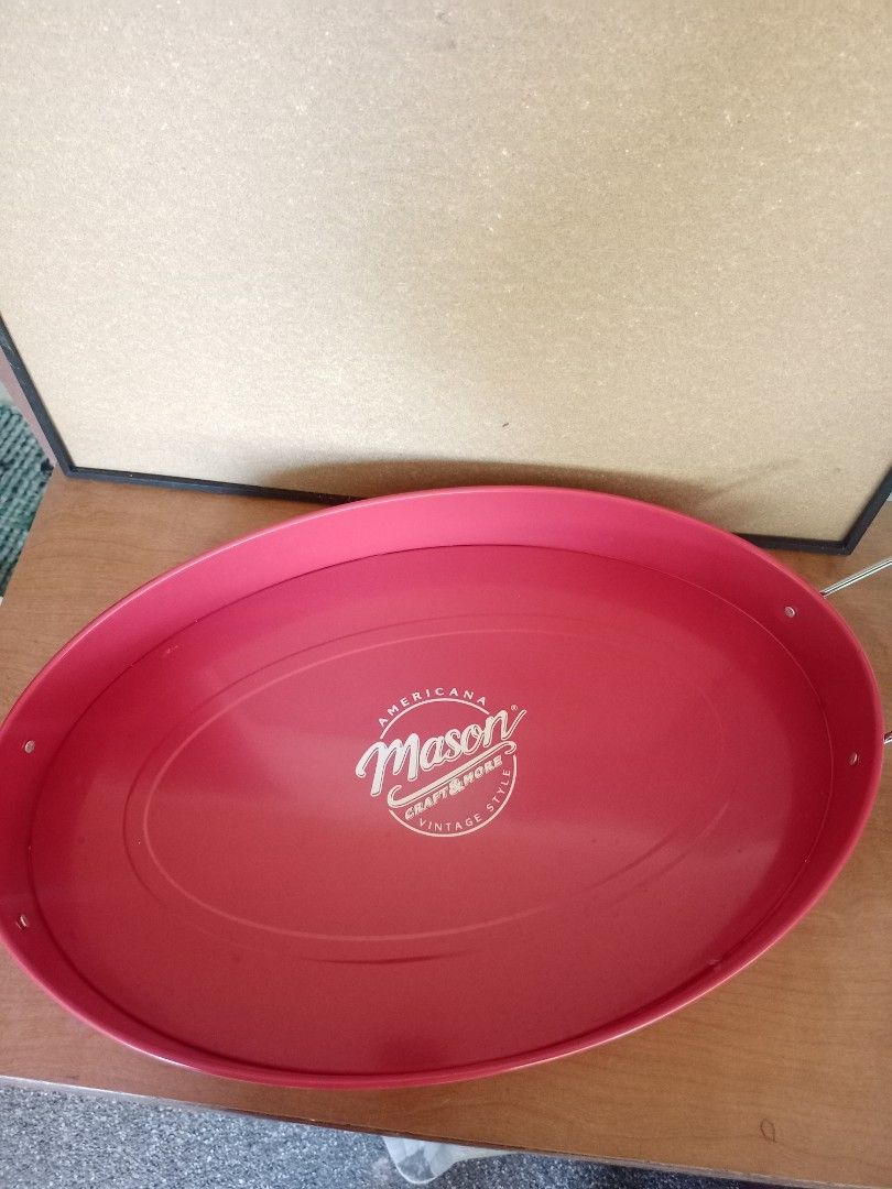 Americana Mason Oval Serving Tray (Category: Other Kitchenware & Tableware) located in Baguio. Submitted by klutter.curio (Listing ID 1431074383, Image 1). Description: Oval serving tray features the Americana Mason logo. It has a vibrant red color and includes handles for easy carrying. The tray is designed with a slightly raised edge to prevent items from sliding off. It's a stylish piece for serving food or displaying items..
