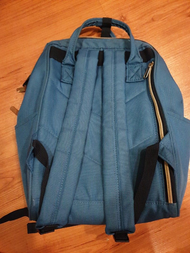 Anello Backpack - Blue (Category: Backpacks) located in Quezon City. Submitted by aredattic (Listing ID 1431067745, Image 3). Description: Blue Anello backpack with a spacious orange interior. Features a top handle and adjustable shoulder straps. Includes a front zipper pocket, 2 side pockets, and a main compartment zipper. The backpack has a small brand tag on the front. flaws: little stains and softened bag structure RFS: decluttering.