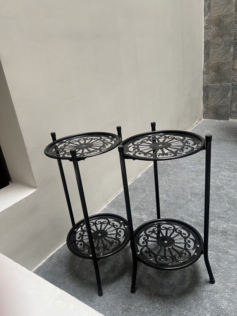 Black Plant Stand (Category: Plants & Seeds) located in Quezon City. Submitted by styleandcomfort (Listing ID 1423237049, Image 1). Description: Not steel. Plastic only. Message me for inquiries - Elegant black metal plant stand - Two-tiered design - Decorative openwork shelves - Ideal for plants and decorative items - Sturdy construction - Classic look - Suitable for indoor or outdoor use.