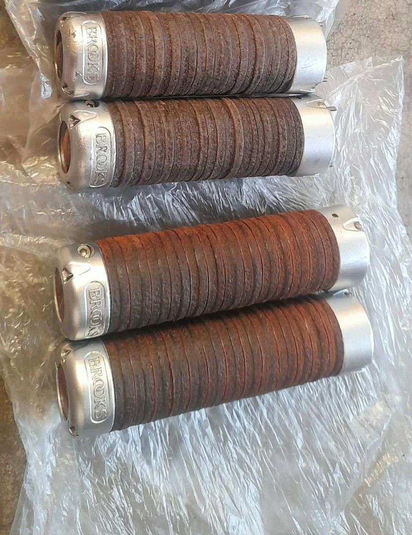 Brooks Leather Handlebar Grips (Category: Bicycles) located in Caloocan City. Submitted by jcob.bikeparts (Listing ID 1431031981, Image 1). Description: Set of Brooks leather handlebar grips. Features a brown leather wrap with silver end caps. The Brooks logo is visible on the end caps. These grips appear to be designed for a bicycle and offer a classic aesthetic. 2.5k for 1 pair.