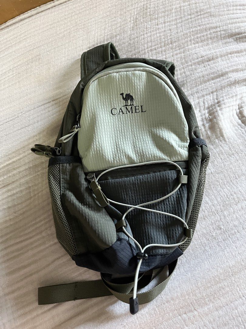 Camel 10L Lightweight Green Hiking Daypack (Category: Backpacks) located in Makati City. Submitted by wind.earth.fire (Listing ID 1431012193, Image 1). Description: CAMEL Hiking Bag. Brand new :) RFS: Ended up needing a bigger one. This is perfect for those who only bring jug, camera, phone, towel, and snacks during a trek/hike. No lowballing please. Bought this for 600+ and this is still brand new..