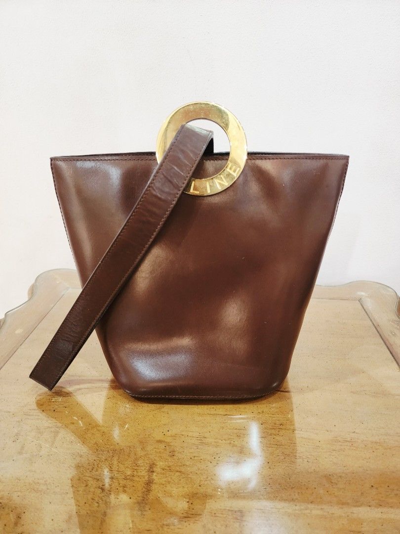 Celine Circle Logo One Handle Bucket Bag (Category: Luxury Bags & Wallets) located in Valenzuela. Submitted by absolutelychick (Listing ID 1322898210, Image 1). Description: meron pong scratch sa front fade sa riri black zipper super light na hairlines sa gold hardwares plrase check picture for reference jrs, lbc, j&t lalamove/grab ready.
