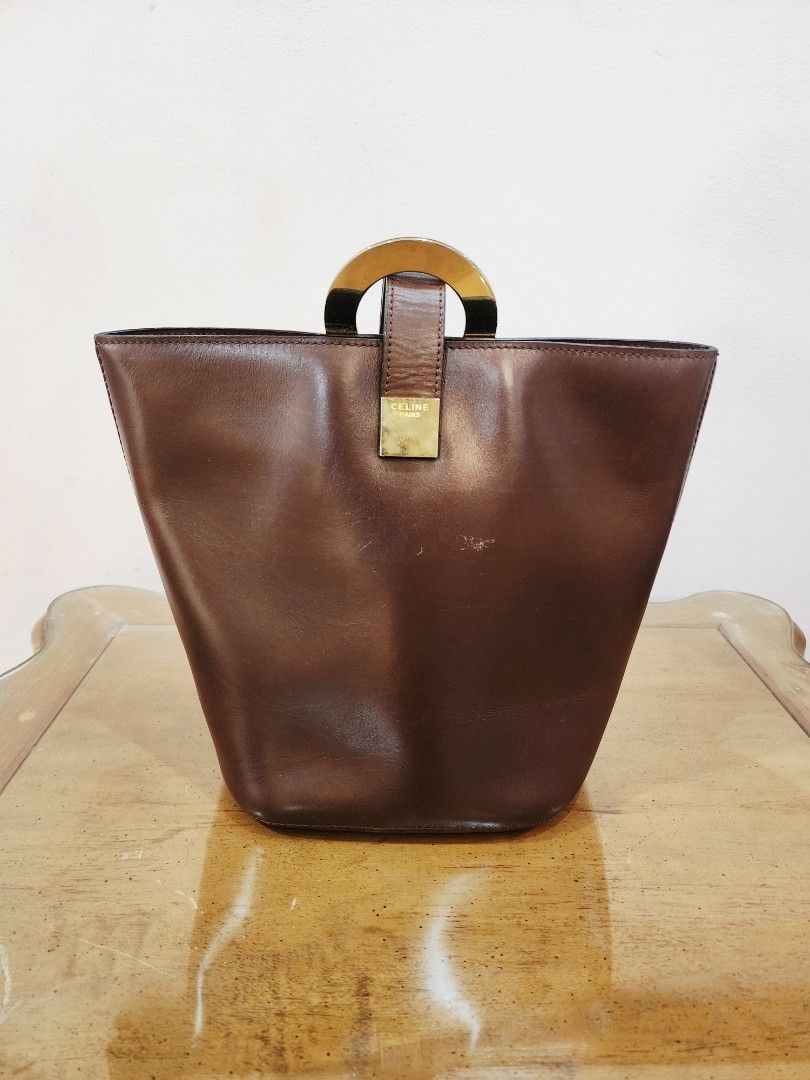 Celine Circle Logo One Handle Bucket Bag (Category: Luxury Bags & Wallets) located in Valenzuela. Submitted by absolutelychick (Listing ID 1322898210, Image 2). Description: meron pong scratch sa front fade sa riri black zipper super light na hairlines sa gold hardwares plrase check picture for reference jrs, lbc, j&t lalamove/grab ready.