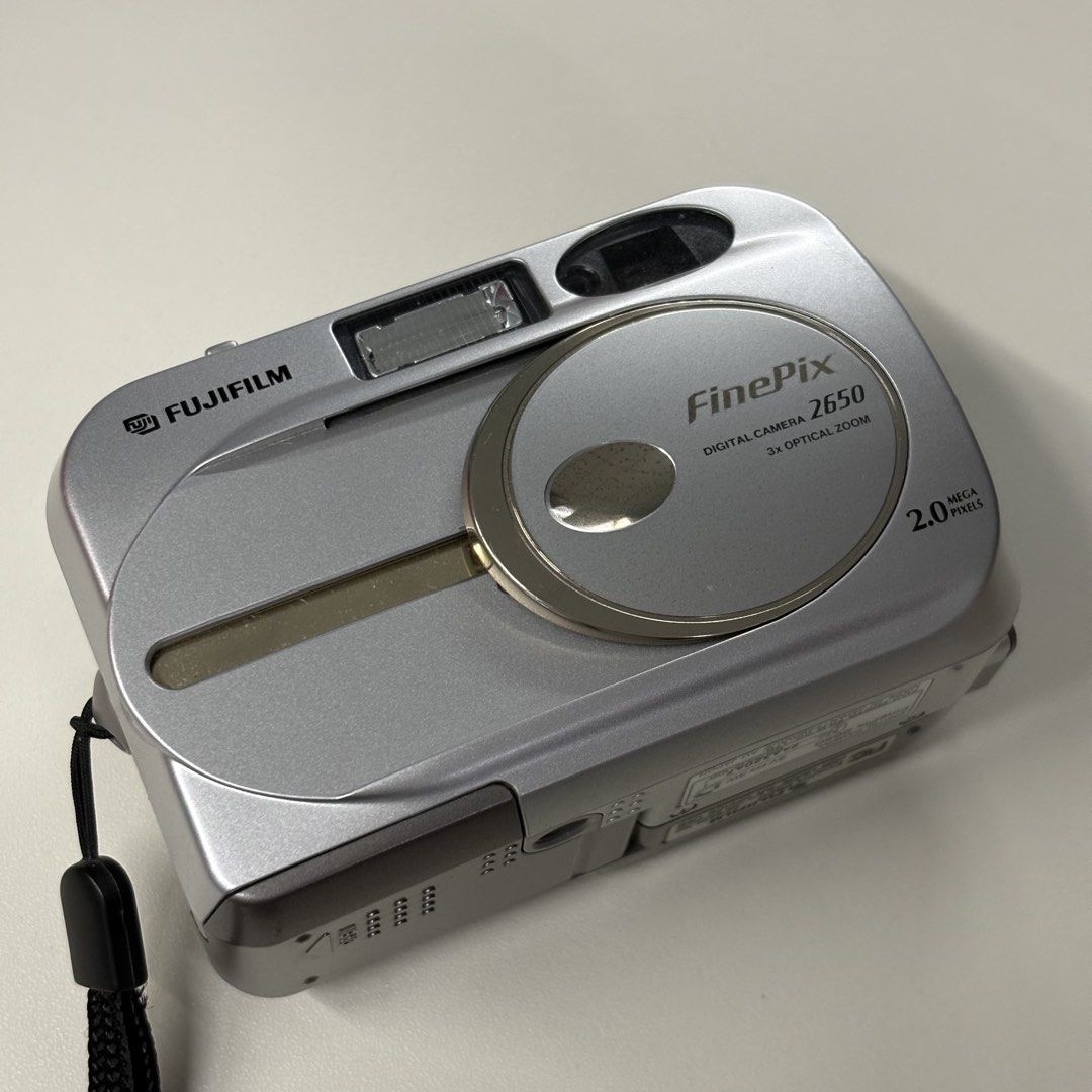 DIGICAM FUJIFILM FINEPIX 2650 DIGITAL CAMERA (Category: Cameras) located in Manila. Submitted by la.memoriaph (Listing ID 1431025453, Image 1). Description: Body: 9/10 2 MP | Released in 2002 Uses XD Picture Card & 2pcs. Double A Battery TESTED: All posted photos are RAW FULLY FUNCTIONAL ISSUE: Gets warm/ hot when battery is inserted even when it’s power off. Can still take perf shots on that state. WHAT’S ON THE BOX: • Unit • Pouch • Beaded Wris