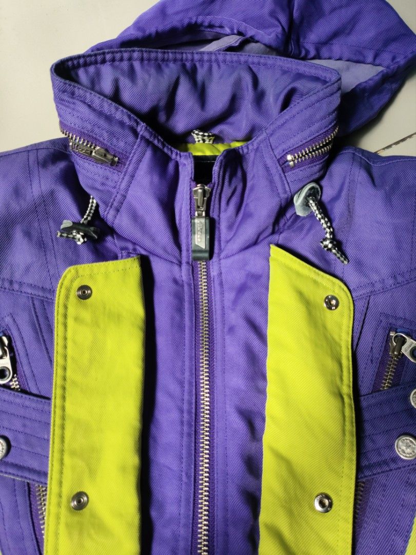 Ellesse Ski Jacket (Category: Coats, Jackets and Outerwear) located in Valencia. Submitted by boxxerus (Listing ID 1430991723, Image 3). Description: Vintage Ellesse ski jacket purple&lime green color combination belt intact. very minor issue, single line run as shown in last pic Measurements: pit-to-pit 22 length 22 waist 18 sleeve length 22 inches. Made by Goldwin. +sf.