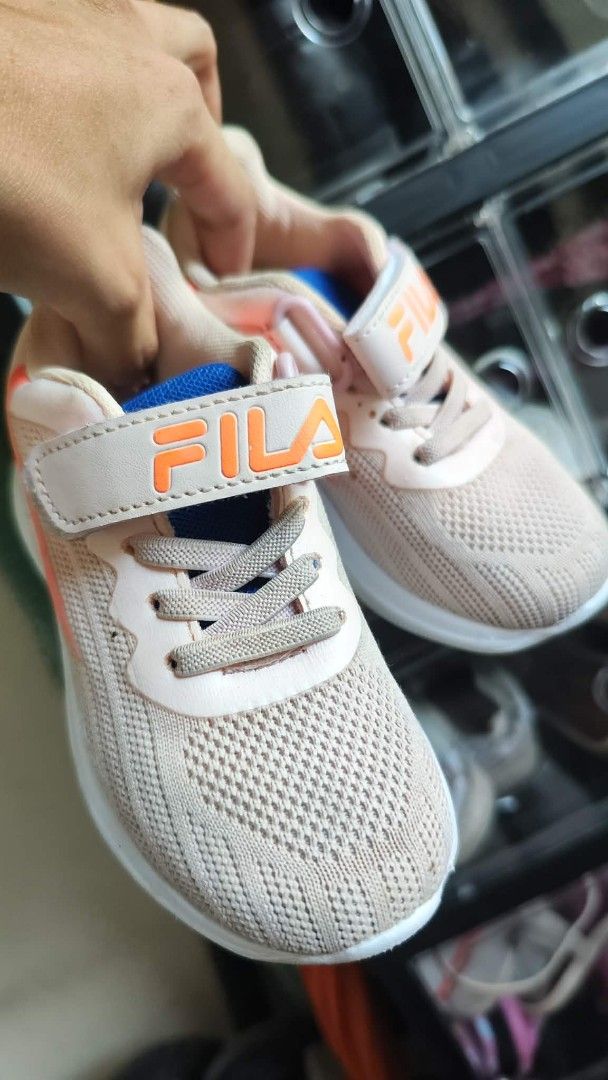 Fila Kids Shoes (Category: Babies & Kids Fashion) located in Cavite. Submitted by nesstuffandeverything (Listing ID 1431117962, Image 1). Description: - Fila kids shoes - Color: Pink and Orange - Size: US 11 / 28 - Features hook-and-loop strap - Fila logo detail - Mesh upper - White sole - Made in China.