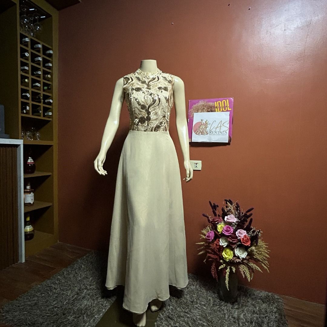 [FOR RENT] Beige Embroidered Gown (Category: Evening dresses & gowns) located in Manila. Submitted by collette.cas (Listing ID 1431021033, Image 1). Description: Elegant beige gown featuring a detailed leaf embroidery and a flowing skirt. Perfect for Ninang's in weddings. Rental fee for 2-3 days, with a refundable deposit. Kindly DM to inquire..