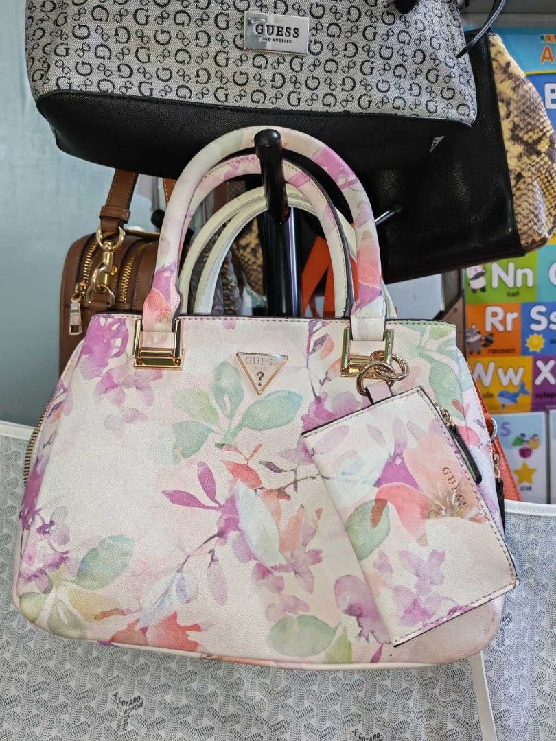 Guess Clai Small Girlfriend Satchel (Category: Luxury Bags & Wallets) located in Manila. Submitted by jewfindshop (Listing ID 1431095920, Image 2). Description: Guess Clai Small Girlfriend Satchel Guess handbag features a beautiful floral pattern. It includes a matching card holder. The bag has a top handle and a detachable shoulder strap. It has multiple compartments inside, including a zippered pocket. The interior lining is branded with the Gu