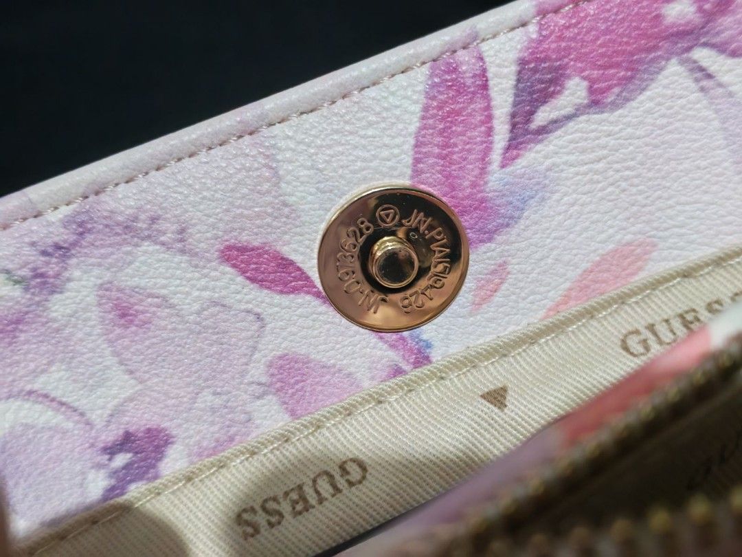 Guess Clai Small Girlfriend Satchel (Category: Luxury Bags & Wallets) located in Manila. Submitted by jewfindshop (Listing ID 1431095920, Image 3). Description: Guess Clai Small Girlfriend Satchel Guess handbag features a beautiful floral pattern. It includes a matching card holder. The bag has a top handle and a detachable shoulder strap. It has multiple compartments inside, including a zippered pocket. The interior lining is branded with the Gu