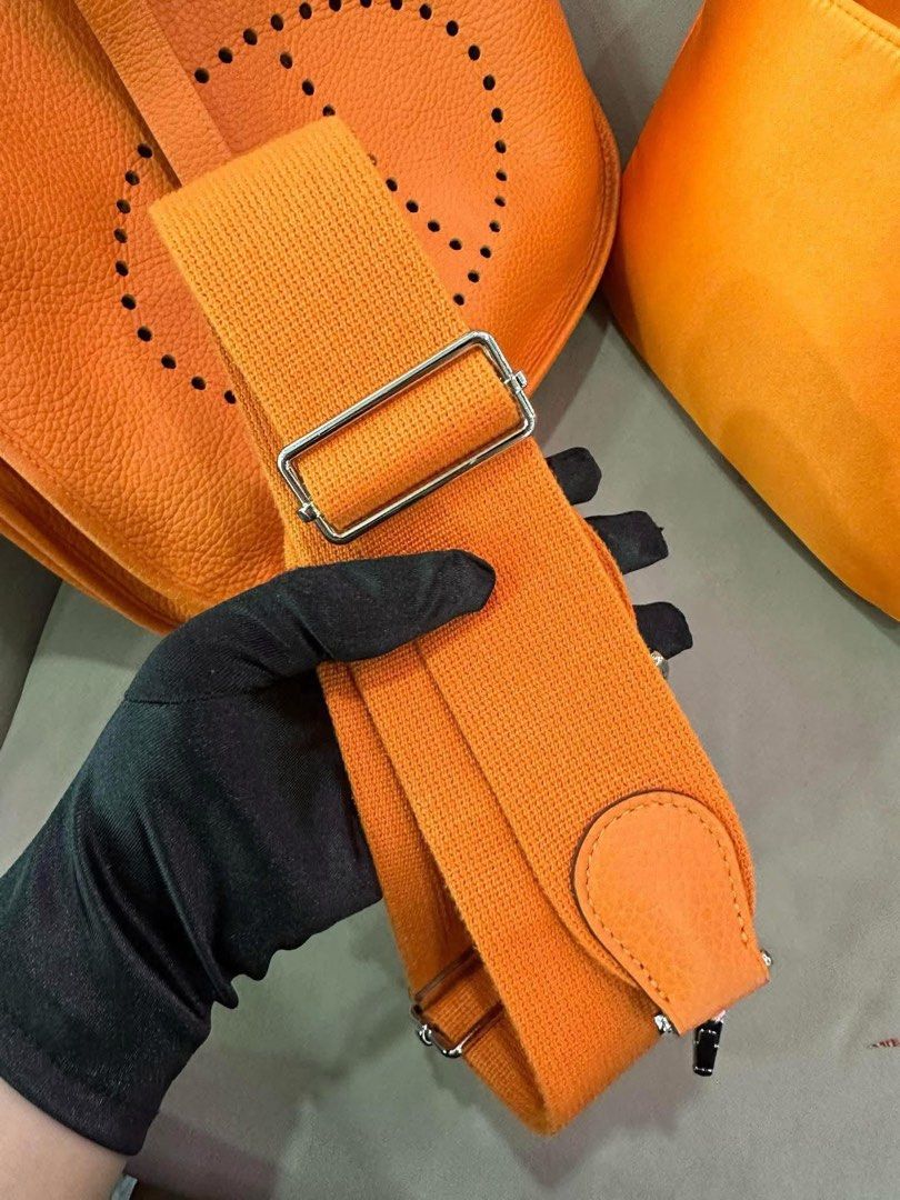 Hermes Evelyne PM3 Orange Handbag (Category: Luxury Bags & Wallets) located in Manila. Submitted by jonalyngal75237 (Listing ID 1431005651, Image 2). Description: Fast break sale! (24 hours only) Excellent used condition With bag organizer, orig dustbag With 2 authenticity cards Guaranteed original.