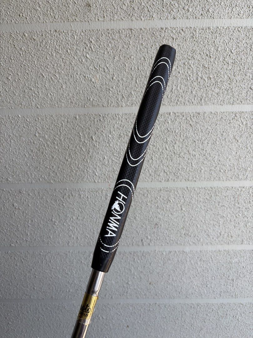 Honma Beres Putter (Category: Golf) located in Santa Rosa. Submitted by rumborro (Listing ID 1430990876, Image 3). Description: - Honma Beres putter - Sleek silver finish - Black grip with white accents and Honma logo - Includes matching head cover - Unique curved shaft design - Honma Beres logo and model number on the head.