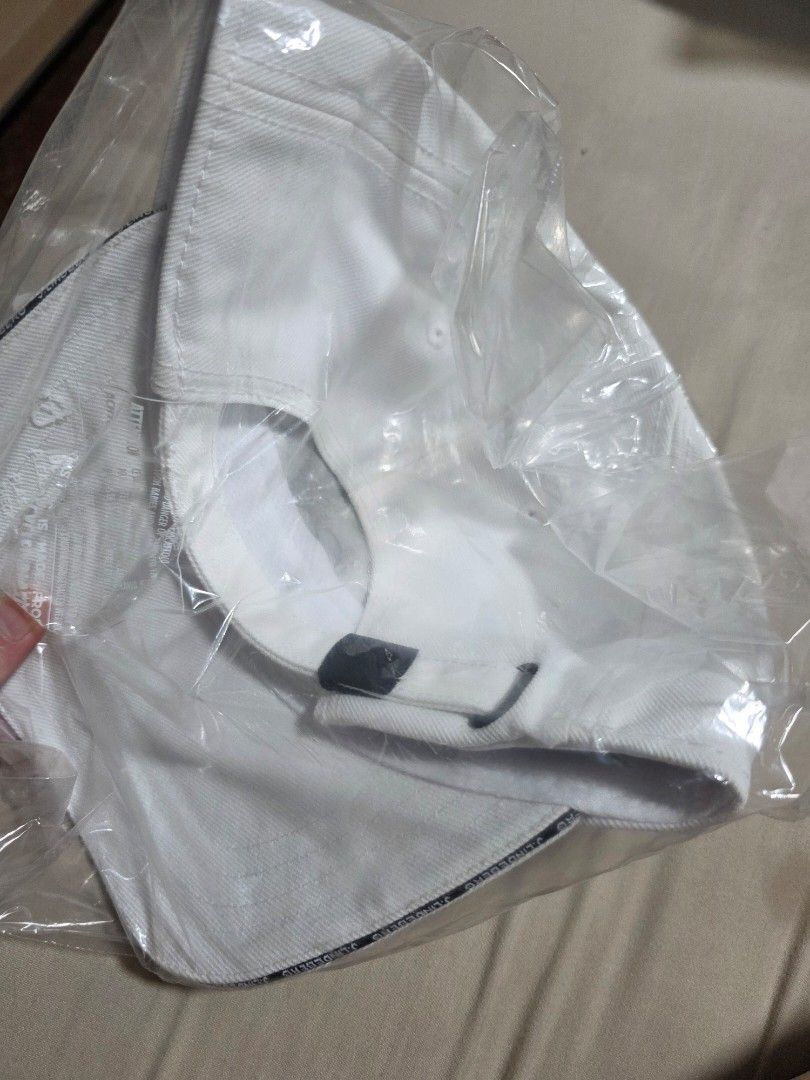 J. Lindeberg White Cap (Category: Caps & Hats) located in Quezon City. Submitted by yGGGG (Listing ID 1431022910, Image 2). Description: White cap from J. Lindeberg. Features the brand name vertically on the front. It has an adjustable strap at the back for a comfortable fit. A classic and stylish accessory for any outfit..