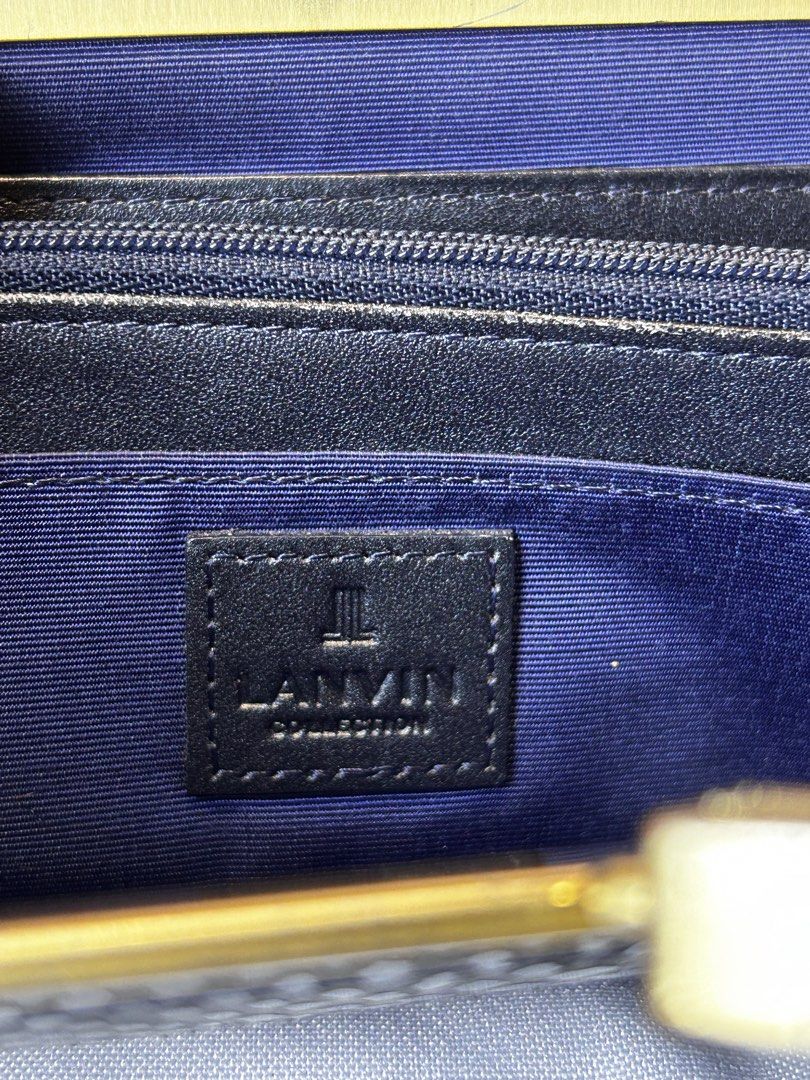 Lanvin Collection Black Wallet (Category: Luxury Bags & Wallets) located in Manila. Submitted by originalvintagebagph (Listing ID 1431154665, Image 2). Description: Authentic From japan Vintage Tarnish and scratches hardware rubs normal sign of ussage maayos pa di pwede sa maarte!! Pls check the photos Elegant black wallet from Lanvin Collection. Features a unique clasp with decorative accents. The interior includes multiple compartments and a zi