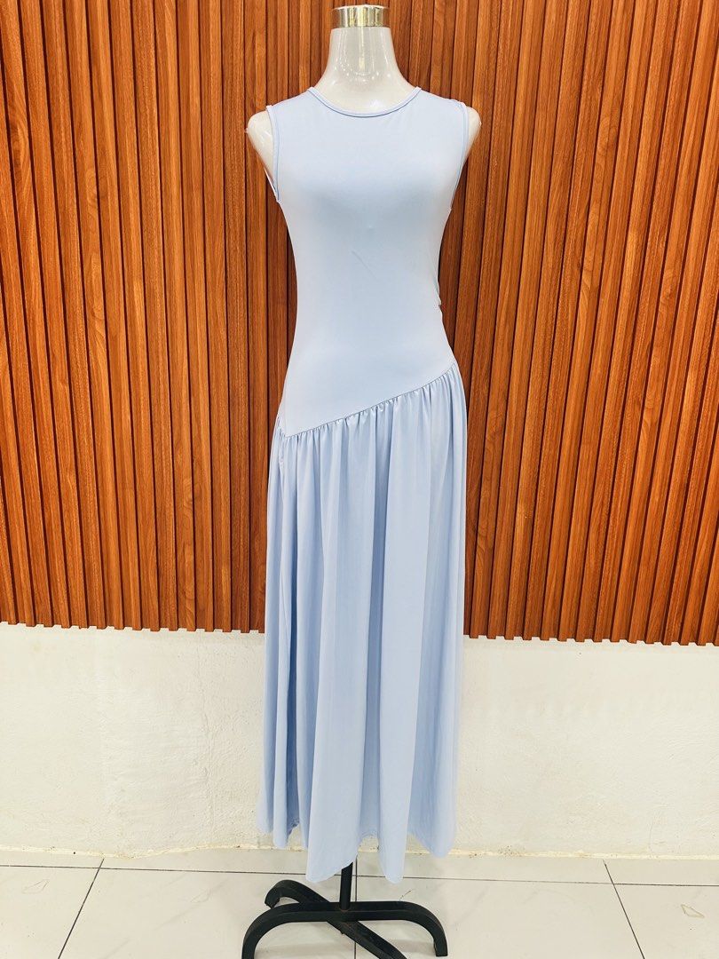 Light Blue Sleeveless Maxi Dress (Category: Dresses) located in Manila. Submitted by cherish_24 (Listing ID 1431020727, Image 1). Description: Elegant light blue maxi dress. Features a sleeveless design with a fitted bodice and a flowing skirt. The dress has a unique diagonal seam detail at the waist, adding a touch of sophistication. Perfect for special occasions or a stylish everyday look..