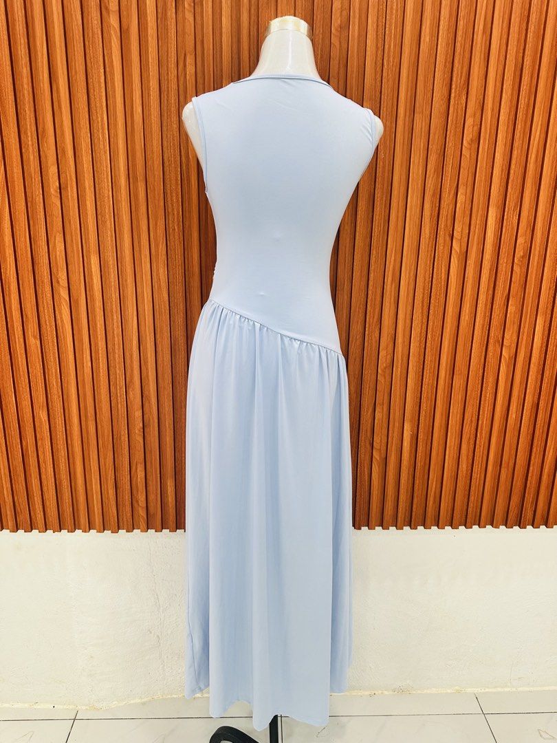 Light Blue Sleeveless Maxi Dress (Category: Dresses) located in Manila. Submitted by cherish_24 (Listing ID 1431020727, Image 3). Description: Elegant light blue maxi dress. Features a sleeveless design with a fitted bodice and a flowing skirt. The dress has a unique diagonal seam detail at the waist, adding a touch of sophistication. Perfect for special occasions or a stylish everyday look..