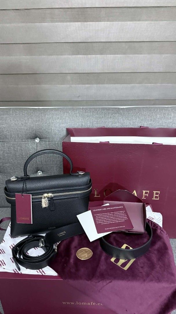 LOMAFE Leri Black with Accessories (Category: Luxury Bags & Wallets) located in Tarlac. Submitted by lollylally (Listing ID 1431097372, Image 2). Description: Leather type: 100% Cowhide Leather Interior Lining: Microsuede Bag Dimensions: Length: 26.2cm Width: 8cm Height: 17cm Handle drop: 7.5cm Bag Strap Lengths: Crossbody Strap (adjustable): 119cm (longest); 106cm (shortest) Shoulder Strap (not adjustable): 29.25cm Features: Zipper 2 straps: 1 s